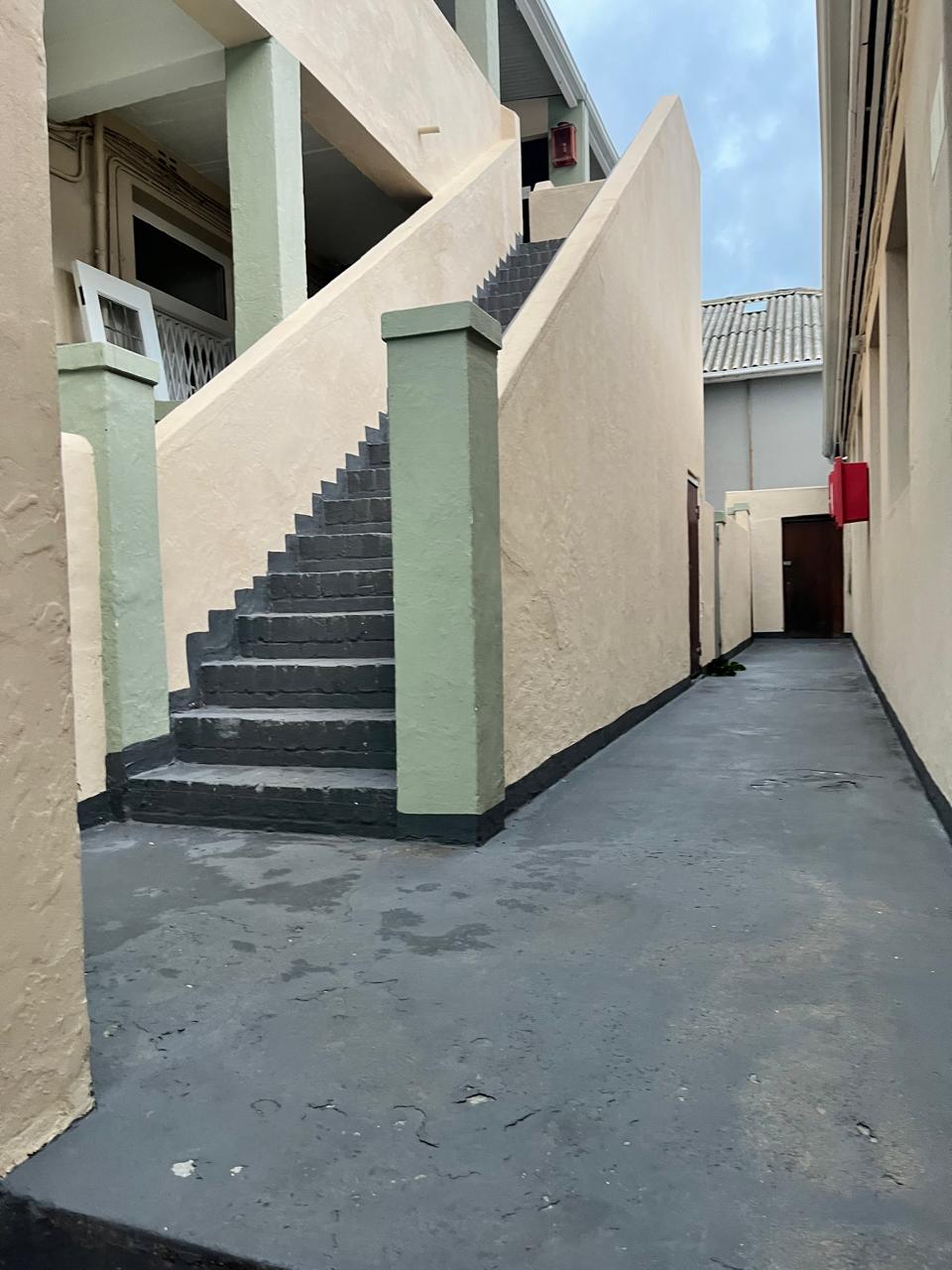 Outdoor staircase leading to the second floor